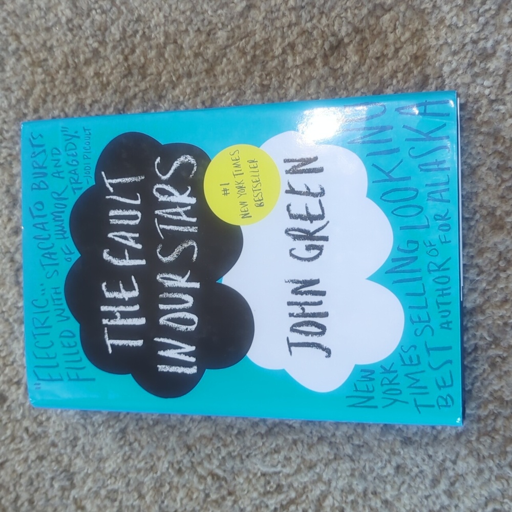 The Fault In Our Stars by John Green. Hardcover book